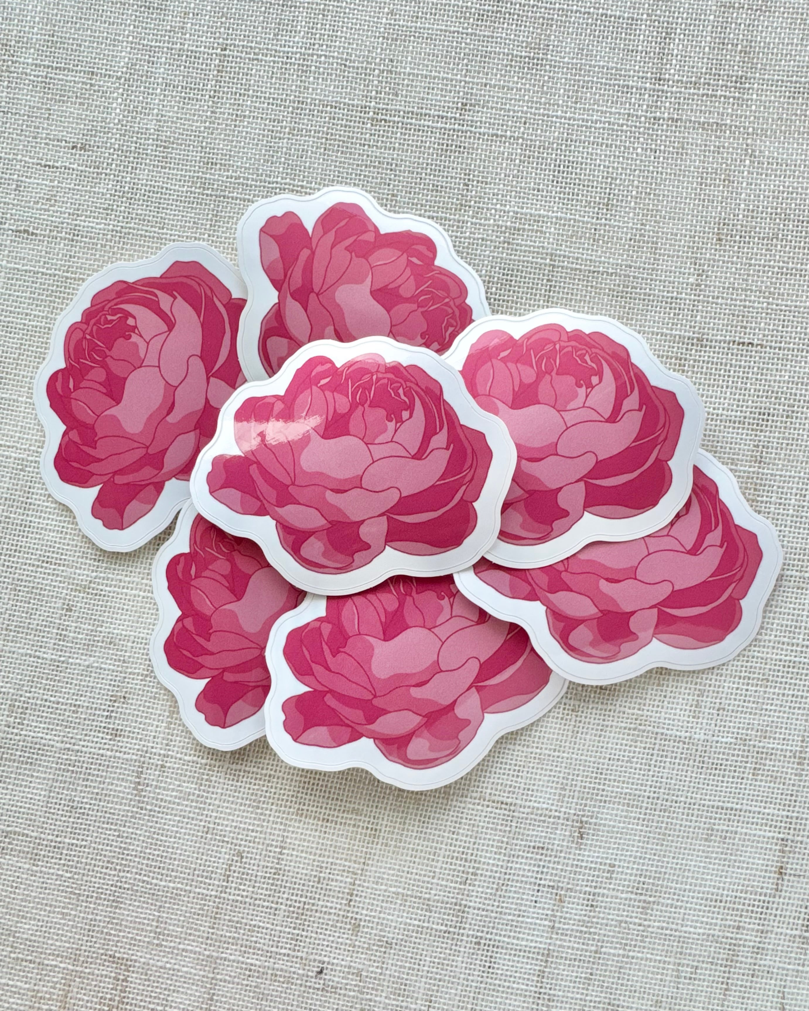 Pink peony stickers on a textured beige background